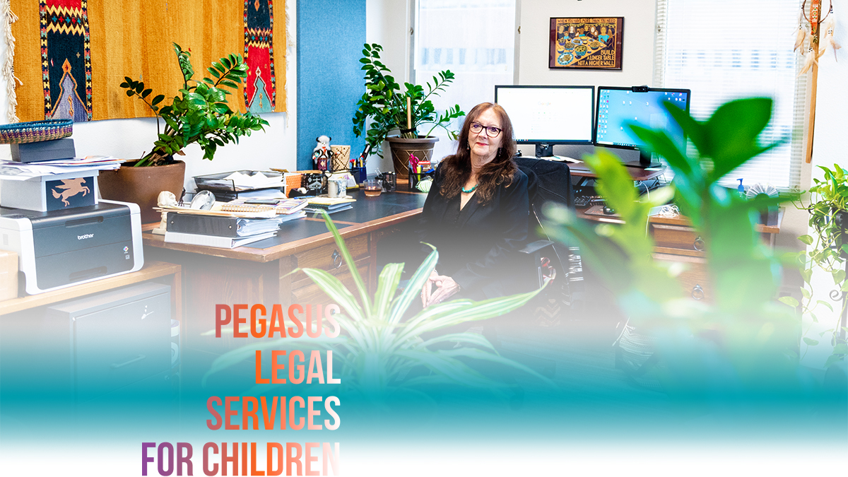 Bette Fleishman, JD, MA, Pegasus Legal Services for Children Executive Director sitting in an office surrounded by art and plants.