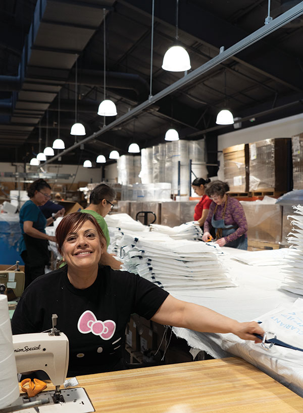 Southwest Creations Collaborative employees sewing bags for local vendor